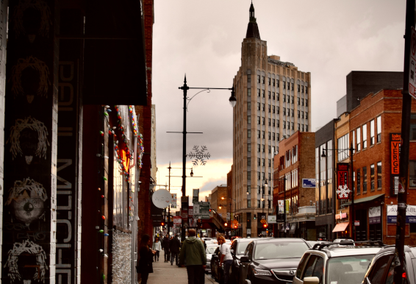 sidewalk in busy city with people walking